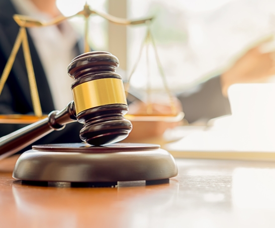 judge-gavel-with-justice-lawyers-having-team-meeting-law-firm-background